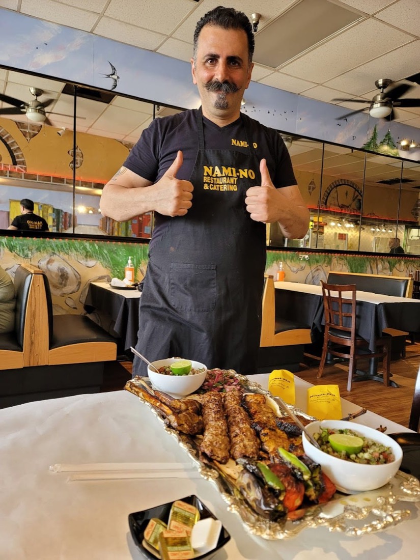 Nami-No's chef presenting a tray of kabobs in the Turlock dining room