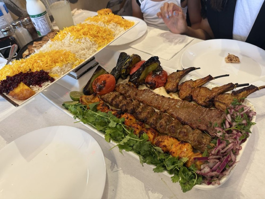 Family platter of mixed kabobs with saffron and barberry rice