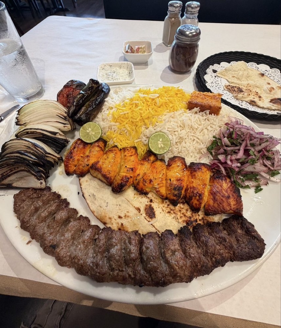 Platter of luleh and chicken kabob with saffron rice and grilled vegetables